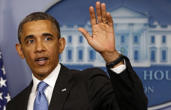 U.S. President Barack Obama waves after speaking at the White House in Washington