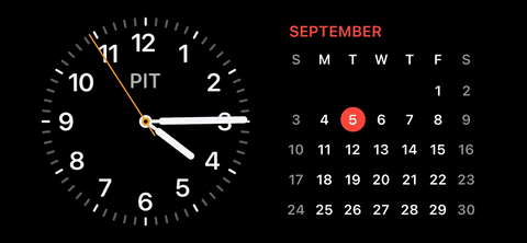 Em iPhoneIslam.com, o relógio aparece em um fundo preto no iOS 17.