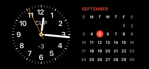 No iPhoneIslam.com, o relógio aparece em um fundo preto, exibindo o iOS 17.