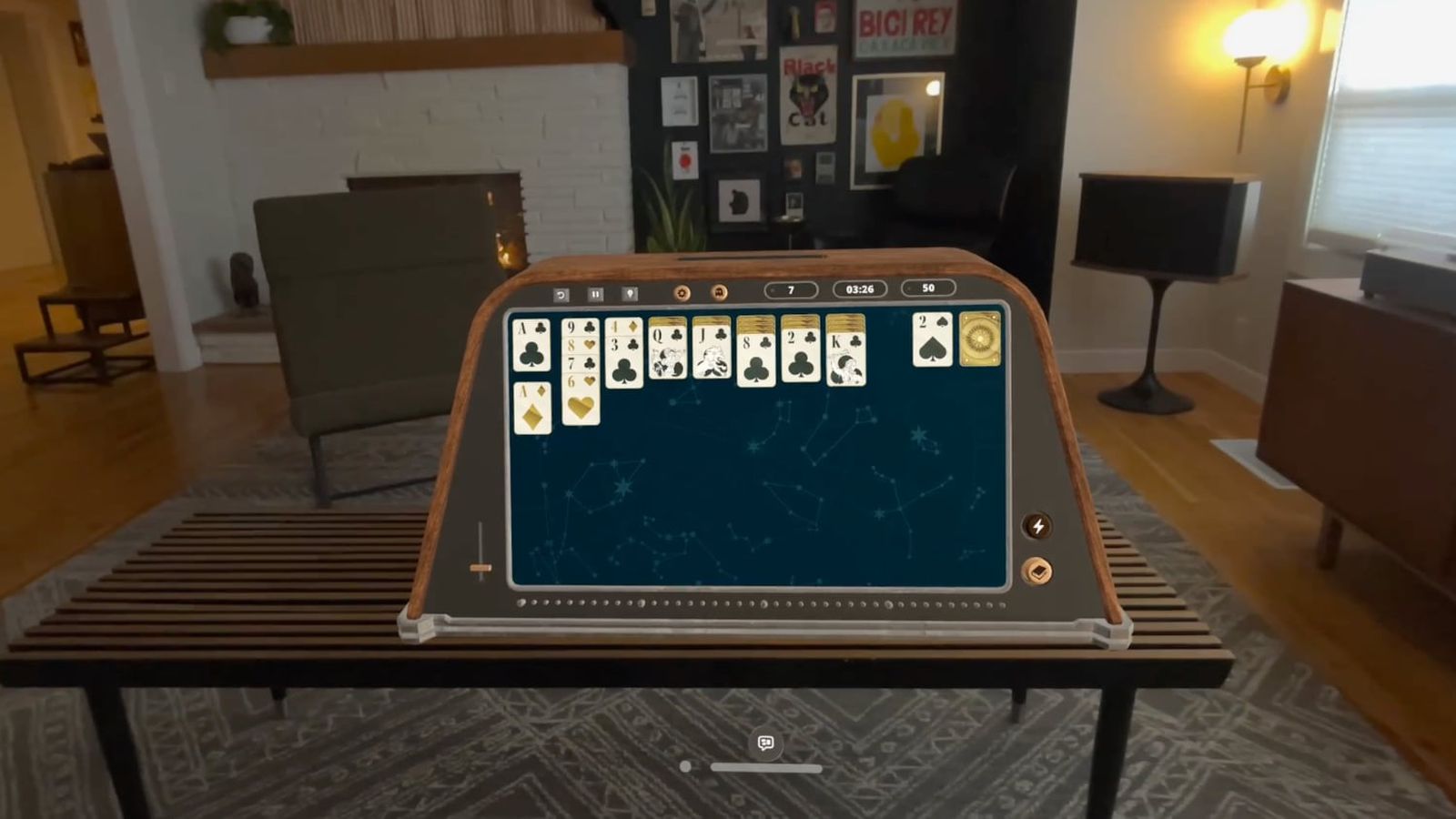 From iPhoneIslam.com, a virtual solitaire game playing on an augmented reality device in a modernly decorated living room during the week of April 19-25.