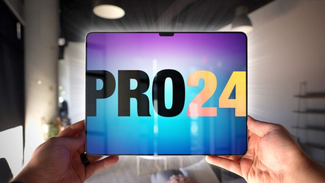 من iPhoneIslam.com، أيدي تحمل جهازًا لوحيًا يعرض "pro24" على الشاشة في إحدى فعاليات Apple في إطار داخلي حديث.