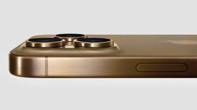 Do iPhoneIslam.com, um close do canto de um smartphone dourado, com um design sofisticado, mostrando três lentes de câmera, um botão lateral e uma elegante camada de metal.