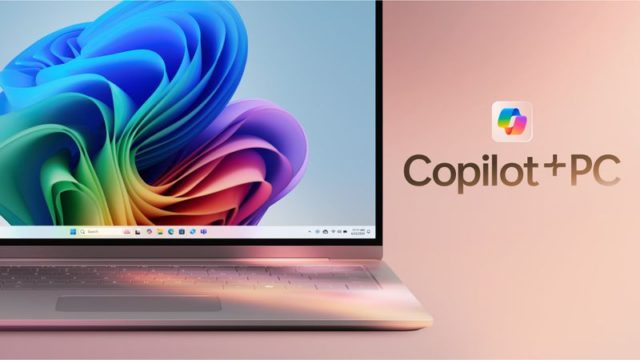 من iPhoneIslam.com، يظهر جهاز كمبيوتر محمول بتصميم حلزوني ملون على الشاشة بجوار النص "Copilot + PC".