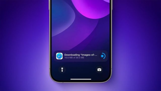 من iPhoneIslam.com، لقطة مقربة لشاشة هاتف ذكي تعرض عملية تنزيل قيد التقدم: "صور..." بحجم 16.6 ميجابايت من 39.5 ميجابايت، على خلفية أرجوانية، وكأنها تعرض أخبارًا عاجلة مع كل بايت تضيف أسرار شهر نوفمبر إلى مكتبتك الرقمية.