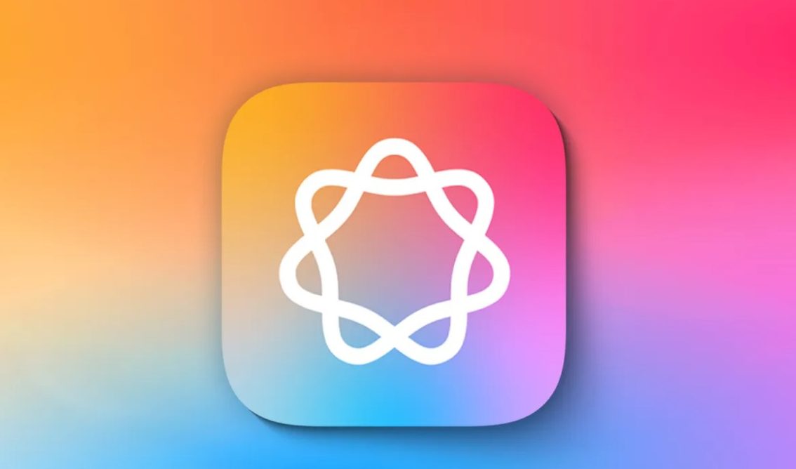 من iPhoneIslam.com، أيقونة تطبيق برمز ذري أبيض على خلفية مربعة، وتتميز بتدرج الألوان الوردي والبرتقالي والأزرق. يجسد التصميم، الذي يتسم بذكاء Apple، الإبداع والابتكار في كل لون.