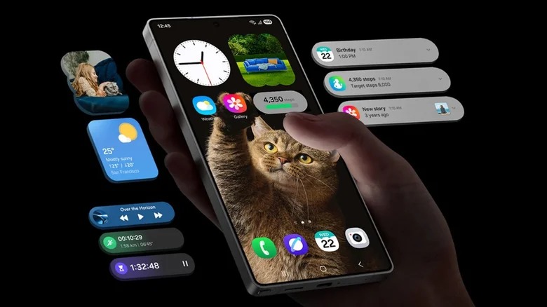 من موقع فون إسلام: يد تمسك يد برو 17 برو بخلفية قطة، محاطة بأدوات تطبيق عائمة تعرض الوقت والطقس والتقويم والرسائل وعناصر التحكم في الوسائط على خلفية سوداء.