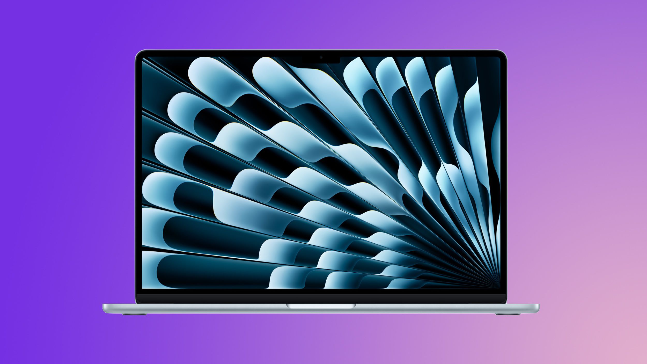 من موقع فون إسلام: كمبيوتر محمول فضي اللون بنمط تجريدي أزرق على الشاشة على خلفية أرجوانية متدرجة اللون.