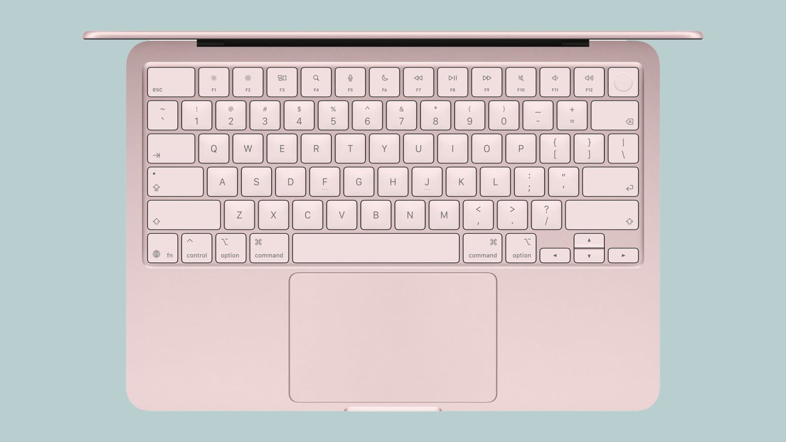 من موقع فون إسلام: منظر علوي للوحة مفاتيح كمبيوتر محمول ولوحة تتبع على خلفية زرقاء فاتحة.