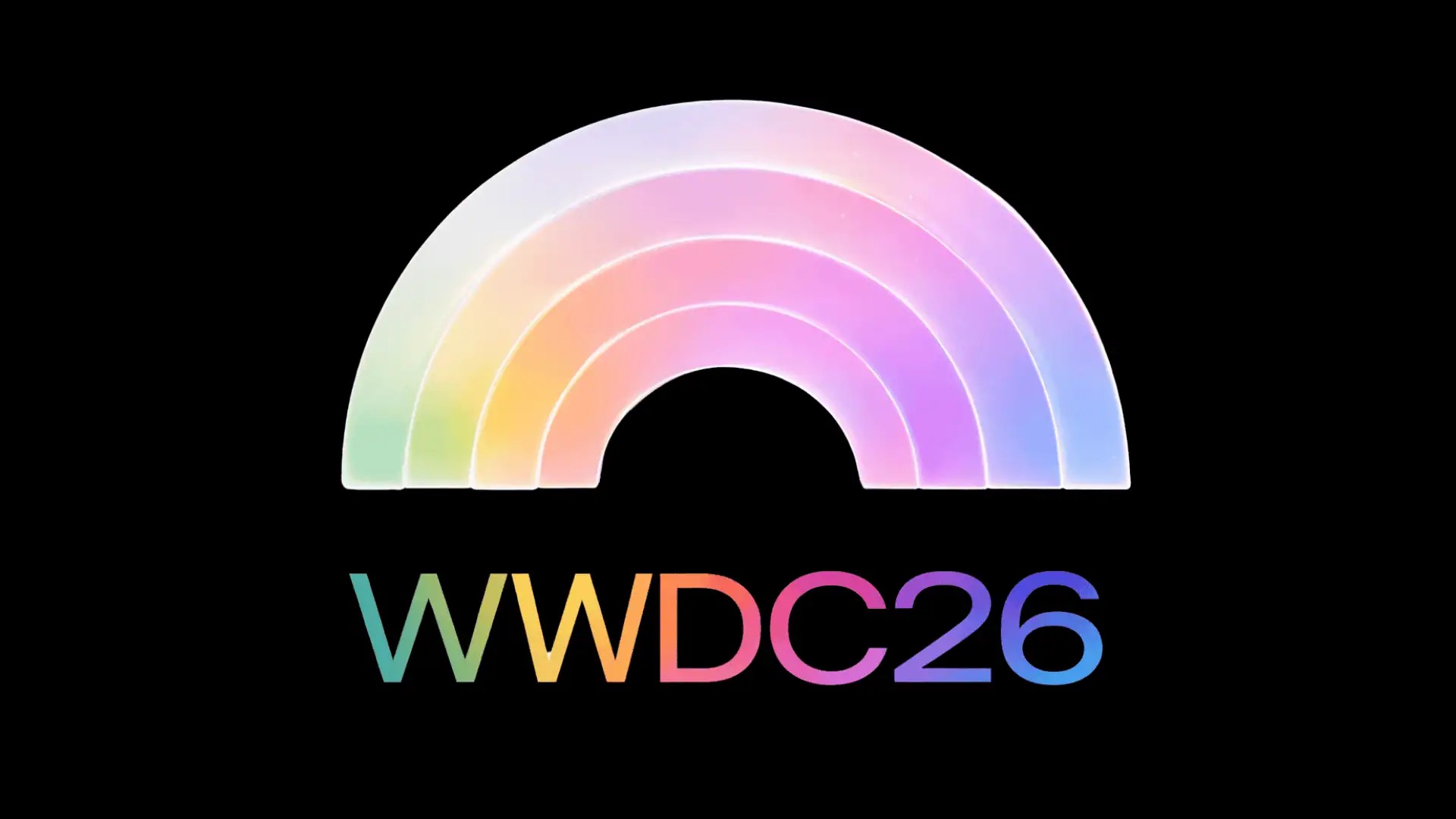 من موقع فون إسلام: قوس قوس قوس قزح بألوان الباستيل فوق النص "WWDC26" بأحرف متعددة الألوان على خلفية سوداء، مستوحى من التصميم الأنيق لـ تطبيق جيميناي للماك.