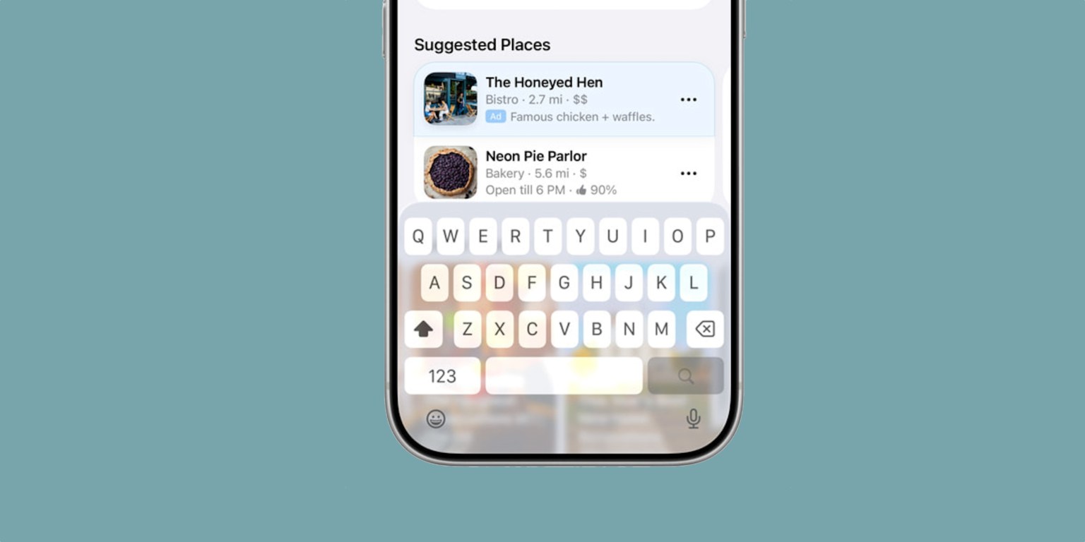 من موقع فون إسلام: توضح شاشة الهاتف الذكي ميزات تحديث iOS 26.5 مع شريط البحث، والأماكن المقترحة مثل "The Honeyed Hen" و"Neon Pie Parlor"، بالإضافة إلى لوحة مفاتيح مفتوحة.