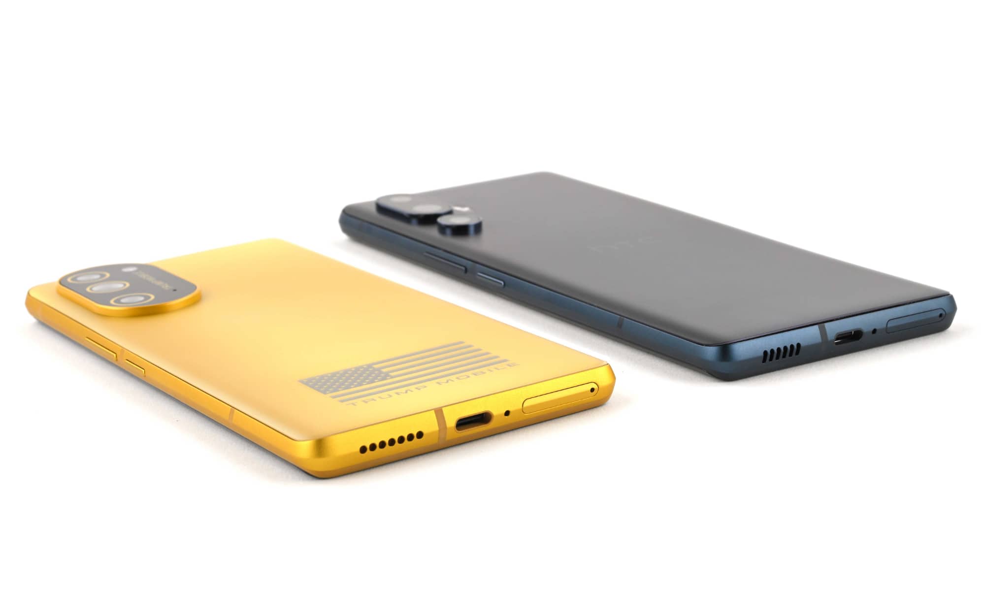 From Phonegram website: Two modern smartphones placed flat on a white surface, one yellow with a flag design, the other dark gray, showing their backs and ports.