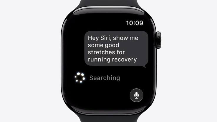 From Phonegram: A smartwatch running watchOS 27 displays a request to Siri: «Hey Siri, show me some useful stretching exercises for post-run recovery», with a search indicator appearing below the text.