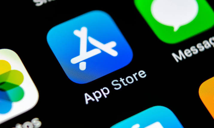 From Phonegram: A close-up of the App Store icon on a smartphone screen, with parts of other app icons and labels appearing alongside it, highlighting how the 'App Store terms in the European Union' affect app availability and user experience.