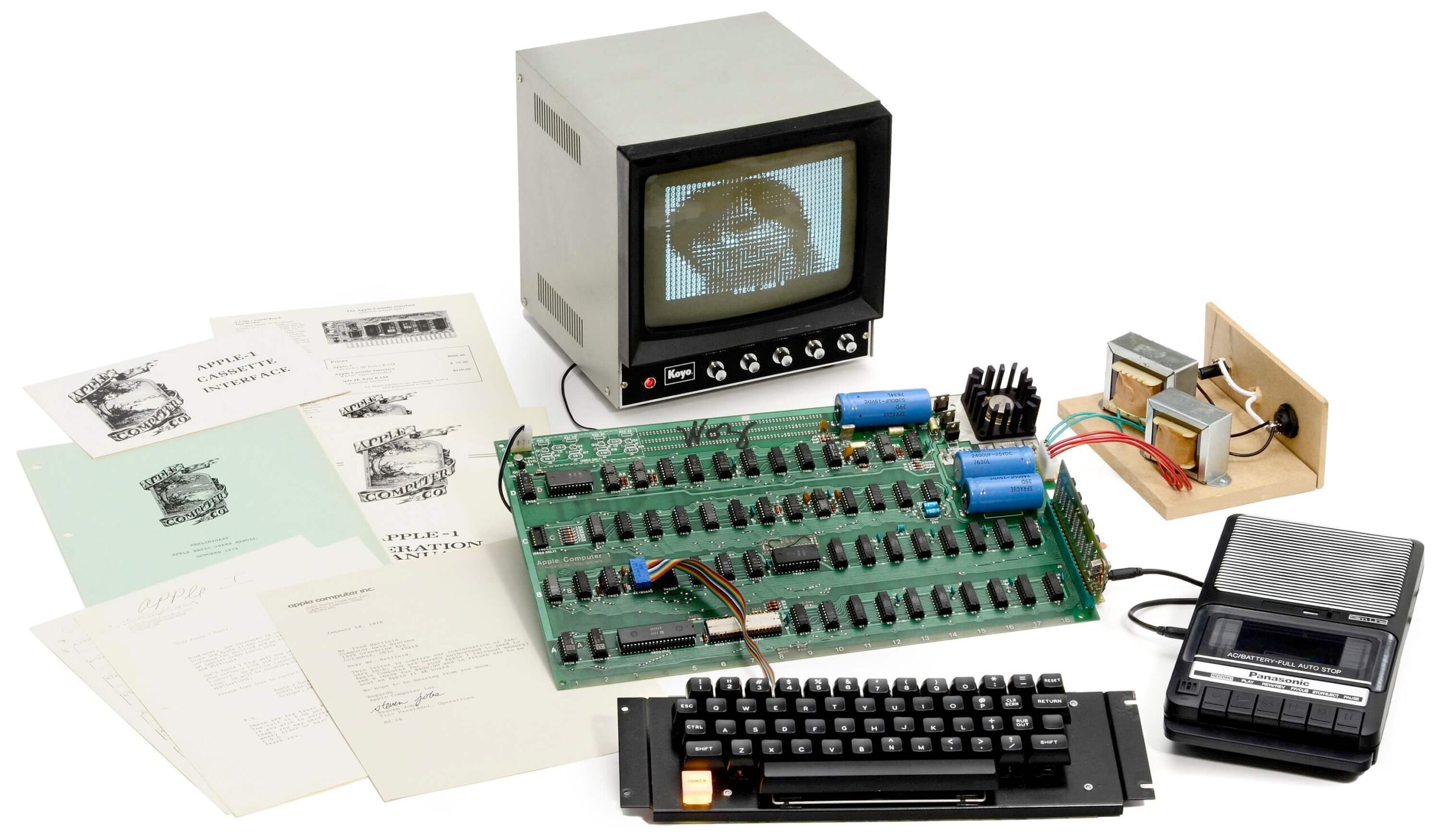 From the Phonegram website: A vintage "Apple-1" computer with monitor, keyboard, cassette player, and original documentation, featured in our "Weekly Sidelines" newsletter.