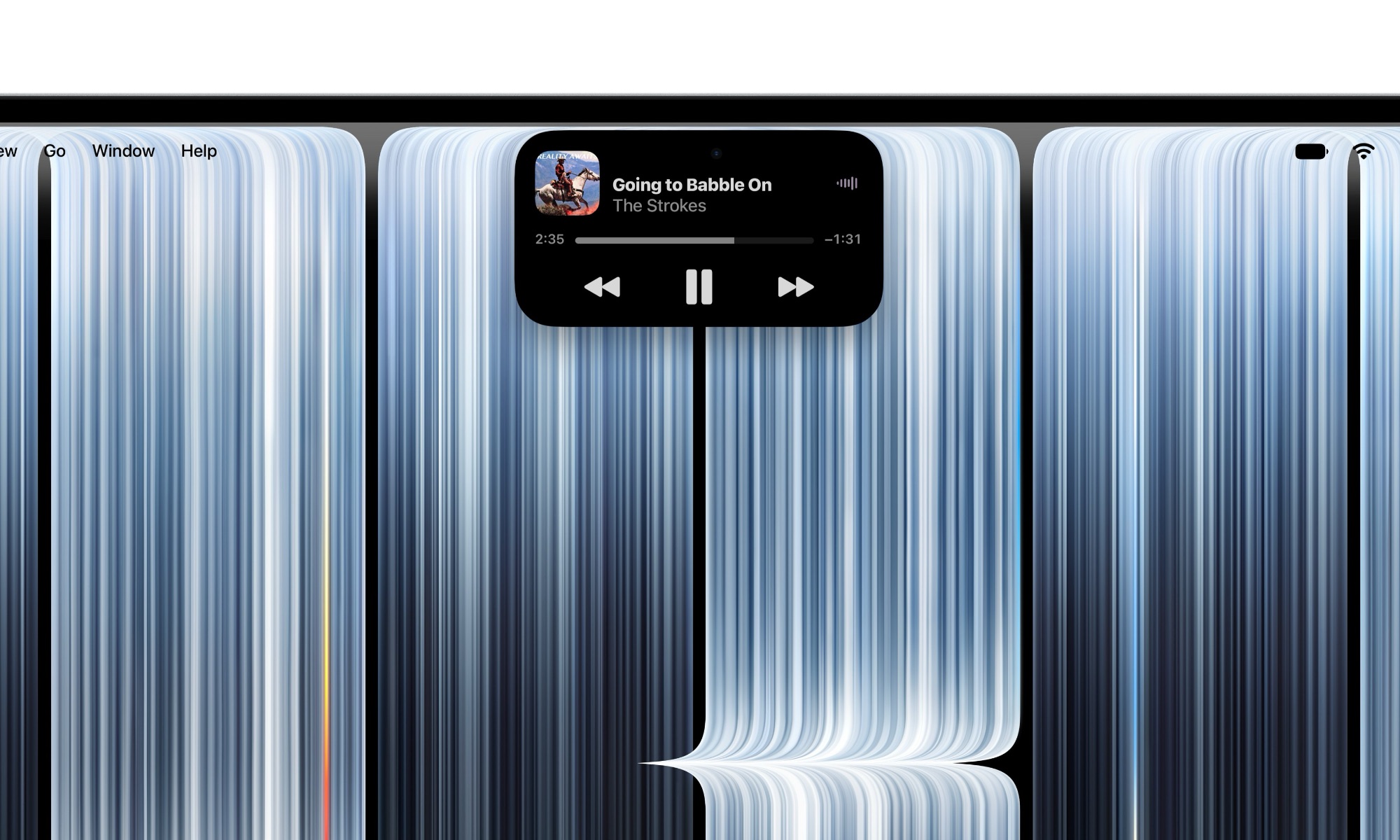 من موقع فون إسلام: أداة مشغل موسيقى تعرض أغنية «Going to Babble On» لفرقة The Strokes، موضوعة في منتصف خلفية سطح مكتب الكمبيوتر التي تحتوي على خطوط زرقاء عمودية تجريدية.