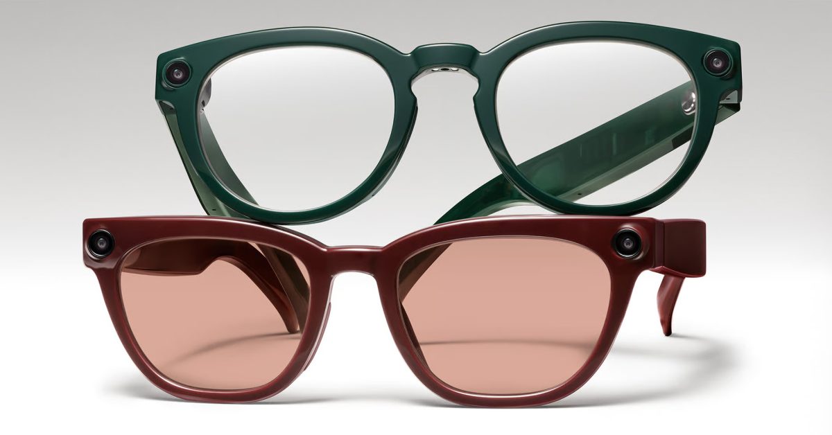 From the Phonegram website: A pair of smart glasses, one in dark green with clear lenses, and the other in dark red with tinted lenses, both equipped with built-in cameras to cover news and current events.